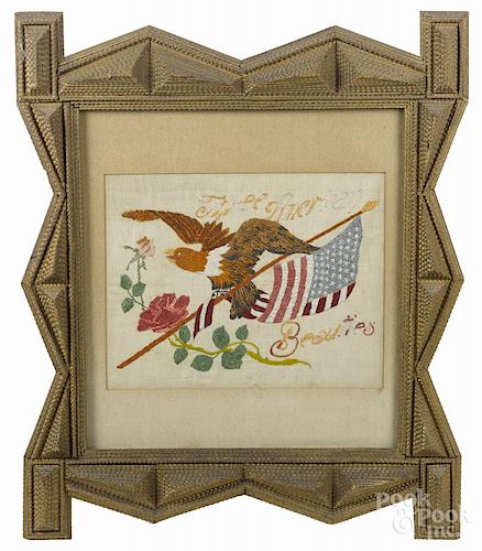 Tramp art carved and painted frame, ca. 1900, with a needlework panel