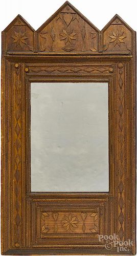 Tramp art carved mirror, ca. 1900, with heart and snowflake decoration, overall - 39 1/2'' x 23 3/4''.