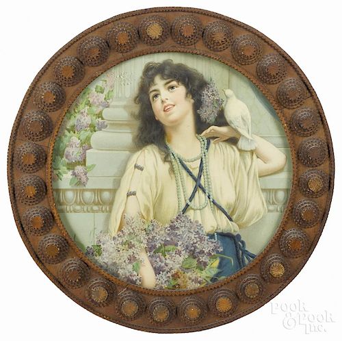 Tramp art carved round frame, ca. 1900, with a portrait lithograph of a woman with a dove
