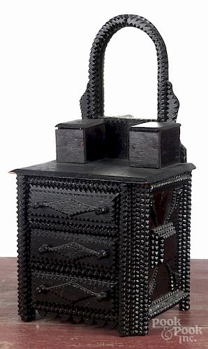 Tramp art carved doll's dresser, ca. 1900, retaining an old black surface, 17 1/4'' h., 8'' w.