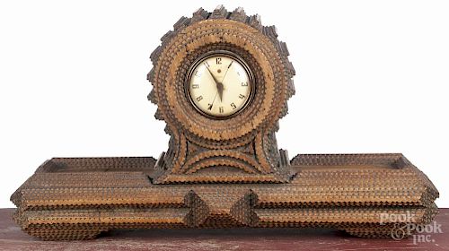 Tramp art carved mantel clock, ca. 1900, 14'' h., 26'' w.