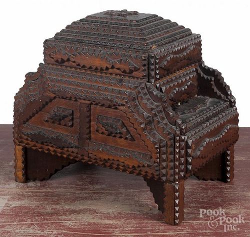 Tramp art carved dresser box, ca. 1900, with a lift lid compartment and two side drawers, 10'' h.