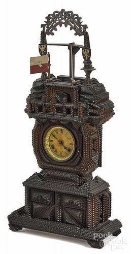 Large tramp art carved shelf clock, ca. 1900, bearing a flag with the coat of arms