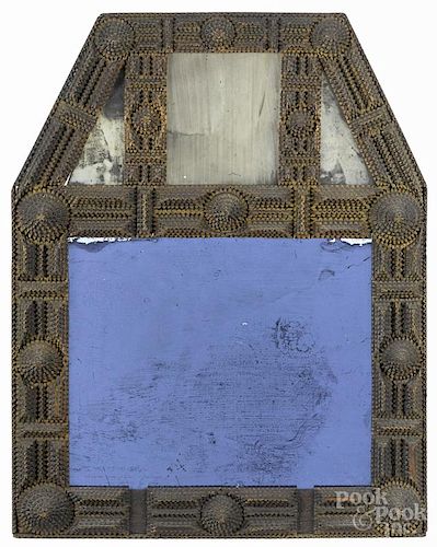 Tramp art carved mirror, ca. 1900, with a lower blue glass mirror plate, overall - 25'' x 19''.