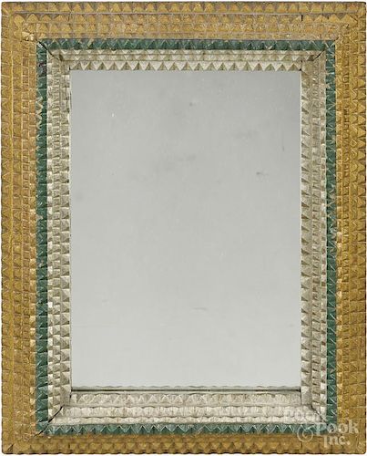 Tramp art carved and painted mirror, ca. 1900, retaining a silver, gold, and green surface