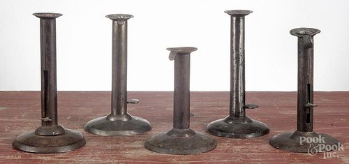 Five tin hogscraper candlesticks, 19th c., tallest - 7 1/4''.