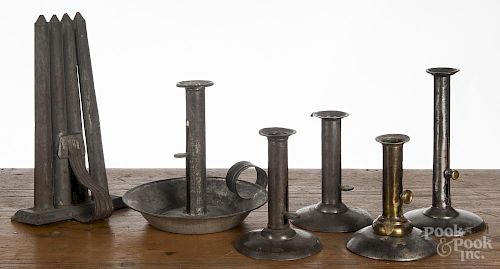 Five tin hogscraper candlesticks, 19th c., tallest - 7 1/2'', together with a tin candlemold.