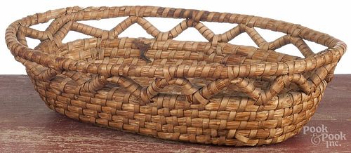 Pennsylvania rye straw basket, 19th c., with an articulated sawtooth rim, 3 1/2'' h., 12 1/2'' w.