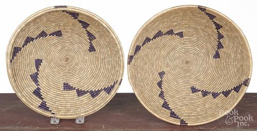 Two Native American woven baskets, 20th c., 10'' dia. and 10 1/2'' dia.