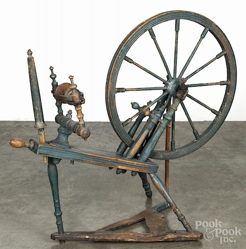 Painted pine spinning wheel, 19th c., retaining an old blue surface, 36'' h.
