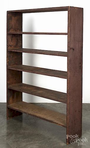 Painted pine bookshelf, 19th c., retaining an old red surface, 61 1/2'' h., 43 1/2'' w., 11 1/2'' d.