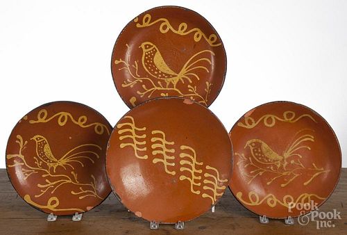 Four contemporary Greg Shooner redware plates, largest - 11 1/2'' dia.
