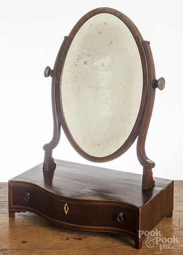 Regency mahogany shaving mirror, 19th c., with a serpentine front and line inlay, 21'' h., 13 3/4'' w.