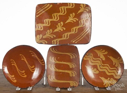 Four contemporary pieces of Greg Shooner redware, largest loaf dish - 12'' w.