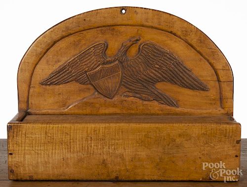 Carved tiger maple slide lid wall box, 19th c., with a spread wing eagle and shield
