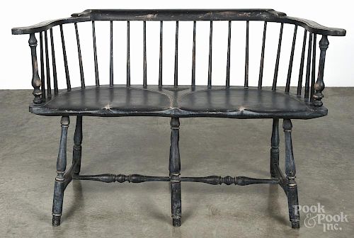 Contemporary painted Windsor settee retaining a black surface, 47 1/2'' w.