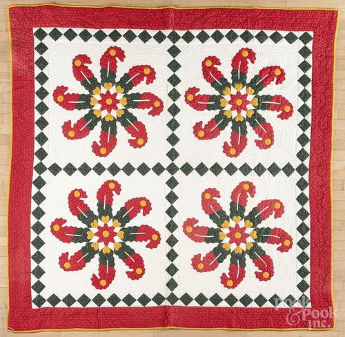 Contemporary pinwheel appliqué quilt with a diamond border, 82'' x 80''.
