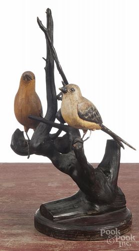 Carved and painted birds, ca. 1900, mounted to a driftwood base, 11'' h.