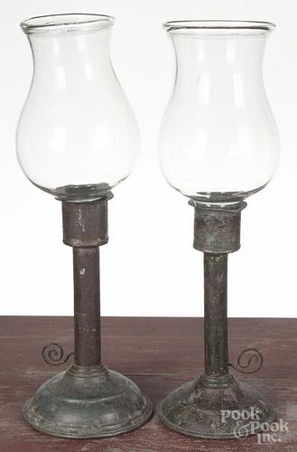 Pair of tin candlesticks, 19th c., with hurricane shades, 18'' h.