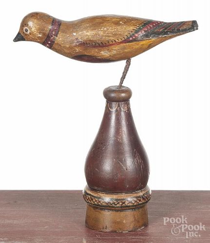 Carved and painted bird, early 20th c., mounted to a turned and painted stand, 11 1/4'' h.