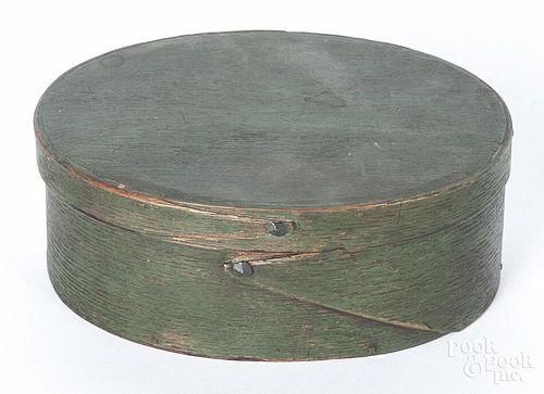 Painted bentwood band box, 19th c., retaining a green surface, 2 1/4'' h., 6'' w.