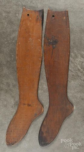 Two wooden sock stretchers, 19th c., 26'' l.