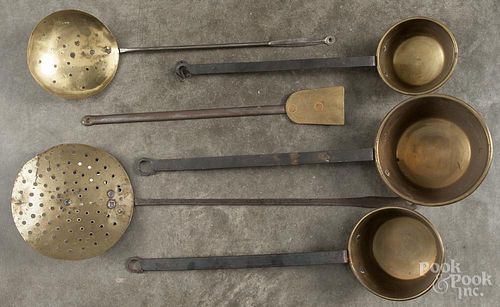 Eleven wrought iron and brass utensils, 19th/20th c., longest - 26''.