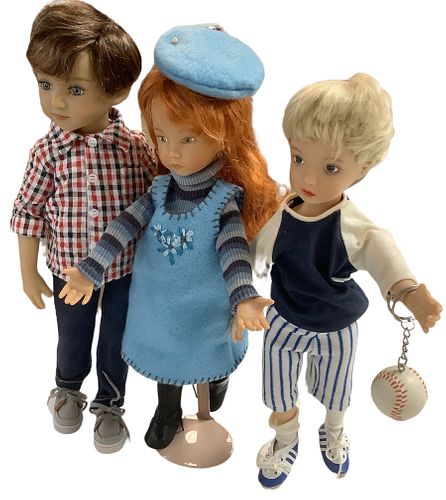 Lot of 3 dolls. First doll with checkered shirt is 13 1/2" tall and marked Maru and Friends in hard vinyl. He has blue inset eyes. Redhead doll is by 