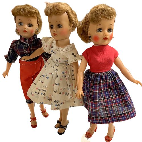 Lot of 3 Little Miss Revlon dolls in vinyl @ 10 1/2" tall. Two dolls have earrings, all retain their shoes. Doll in cream dress has a loose head.