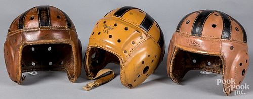 Three leather football helmets, mid 20th c.