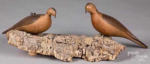 Pair of carved and painted dove decoys, 20th c.