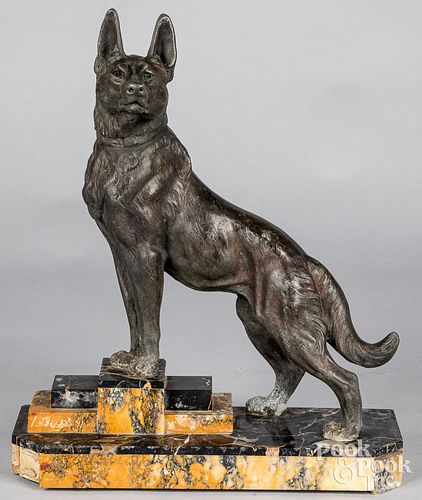 White Metal sculpture of a dog, with marble base