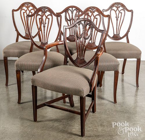 Four English Hepplewhite mahogany dining chairs