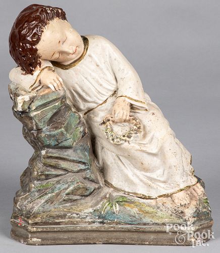 Plaster figure of a resting child