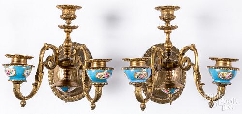 Pair of brass sconces, with porcelain inserts