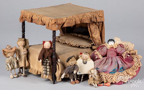 Family of early wood dolls, 19th c.