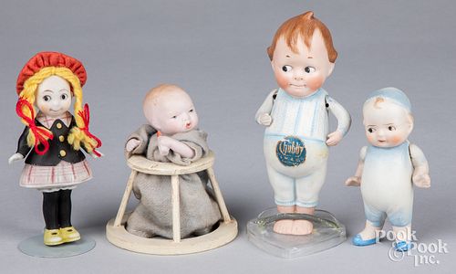 Four small bisque dolls