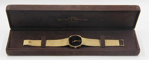 WATCH. 14kt Baume & Mercier Men's Wrist Watch.