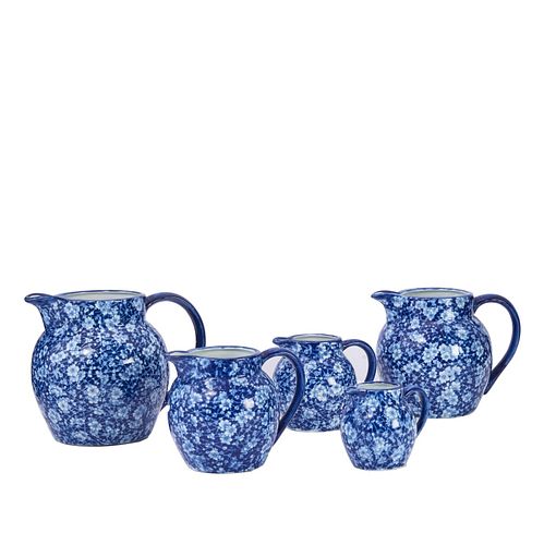 5 blue and white English pitchers
