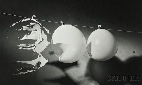 Harold E. "Doc" Edgerton (American, 1903-1990)      Bullet Passing Through Three Balloons