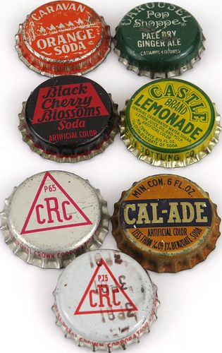 Lot of Seven "C" Cork-backed Bottle Caps 