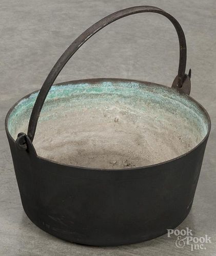 Bronze cooking pot, 19th c., with a swing handle, 14 3/4'' dia.