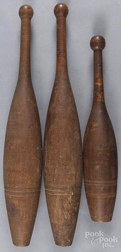 Three Indian clubs, late 19th c., 26'' h. and 19 3/4'' h.