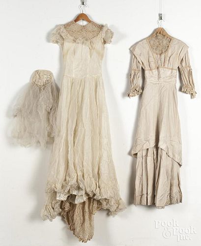 Various fabrics, 20th c., to include two wedding gowns, lace doilies, and miscellaneous hats.