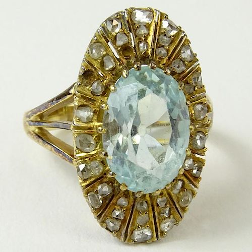Antique Oval Cut Aquamarine, Rose Cut Diamond and 14 Karat Yellow Gold Ring. Aquamarine with nice even color, VS clarity. Measures 12.95 x 9.0 x 6.0mm
