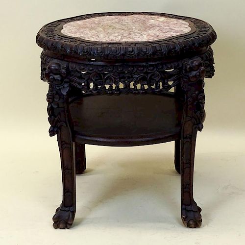 Antique Chinese Carved Hardwood Marble Top Pedestal Tables. Unsigned. Good condition. Measures 22-1/2" H x 17" dia. Shipping: Third Party.