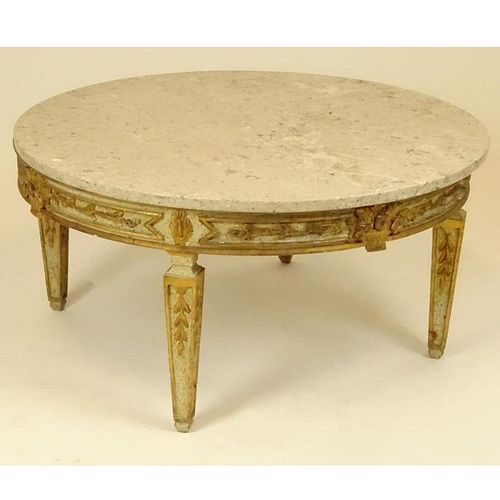 Mid 20th Century Italian carved and parcel gilt wood coffee table with marble top. Unsigned. Measures 18" H x 35-1/4" dia. Shipping: Third party