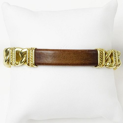 Men's David Yurman Heavy 18 Karat Yellow Gold and Brown Leather Bracelet. Signed 750. Very good condition. Measures 8-1/4 inches long. Approx. weight: