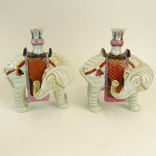 Pair Mottahedeh Chinese Style Porcelain Elephant Vases. Signed. One with loss to foot, minor paint wear. Measures 9-1/4" H. Shipping $65.00