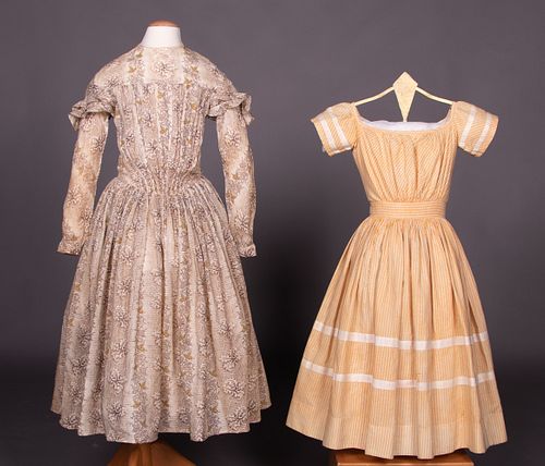 TWO PRINTED GIRL'S DRESSES, 1840s & 1850s